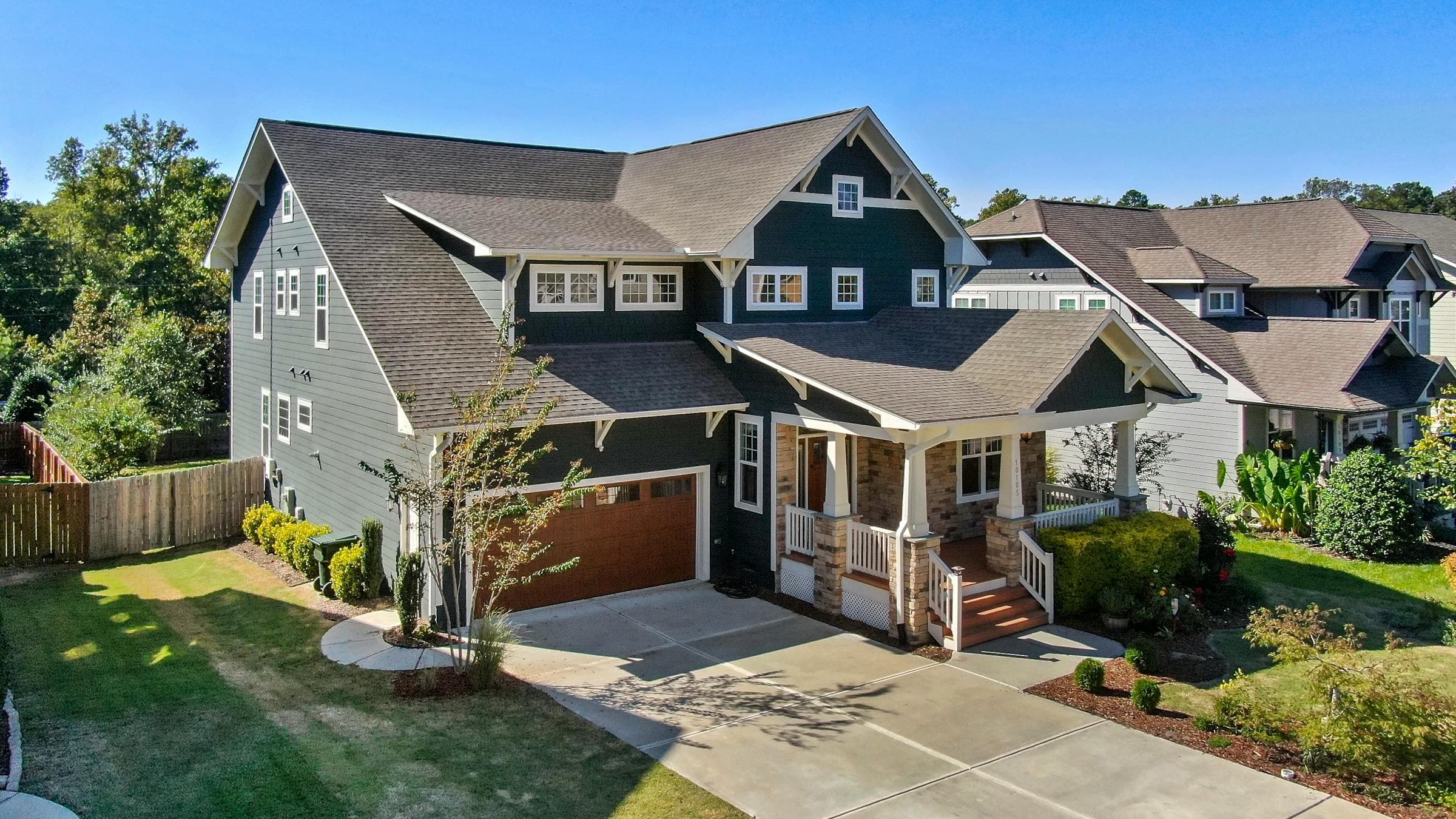 Craftsman-style home with a manicured lawn in Central Texas